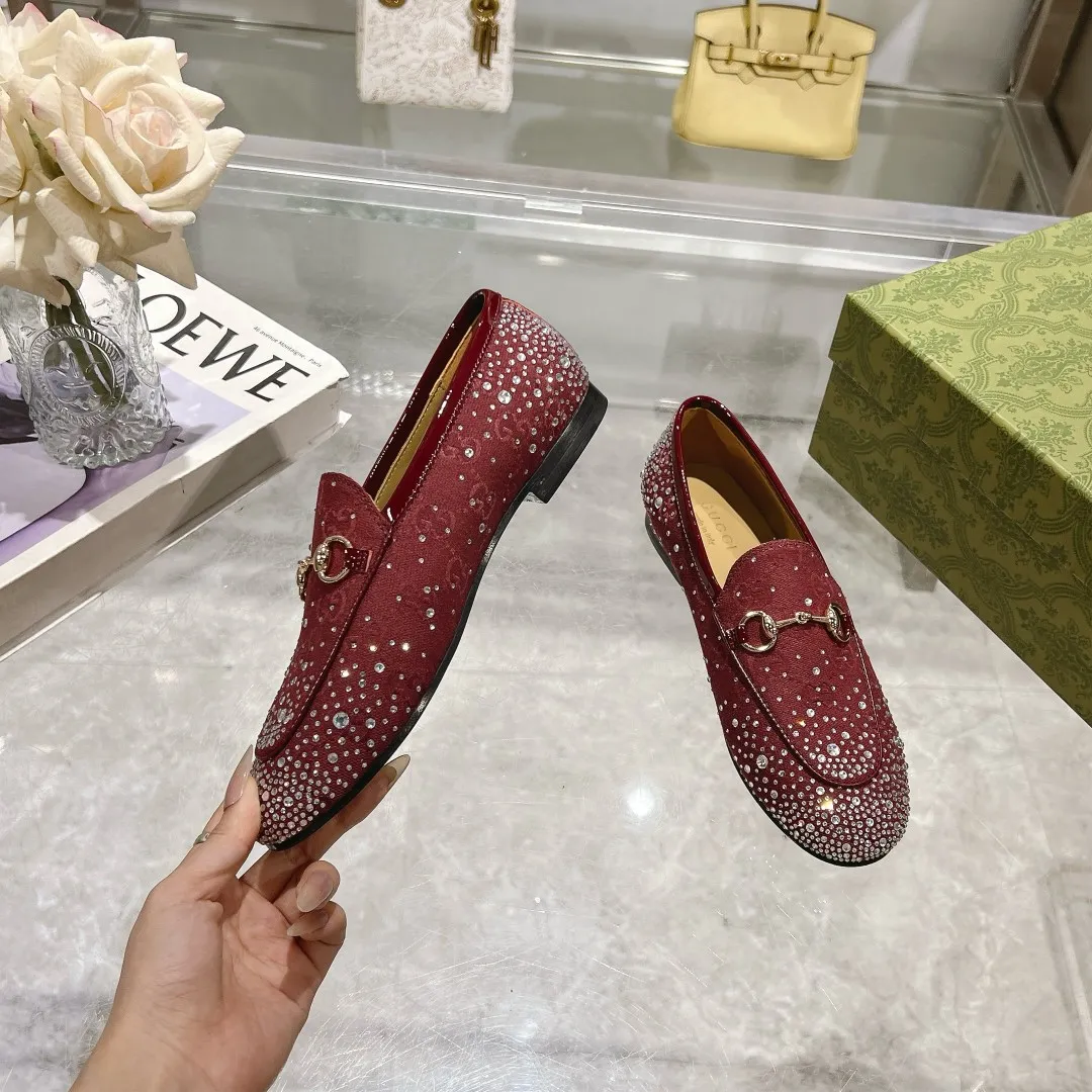 👟👟Ex-factory price 500👟👟 Genuine leather sole +50 (35-41) (41/42 customized) As an outstanding representative of Gucci’s design heritage, the Jordaan series of loafers with horsebit buckles vividly highlight the classic and elegant style. Crafted from the brand's signature monogram canvas, this shoe is timeless. Made from soft material and with a refined, smooth silhouette, these shoes are a perfect expression of everyday elegance. Gucci Angora Red GG Canvas Women Light Gold Tone Hardware Horsebit Faceted Crystal Detail Leather Sole Flat.